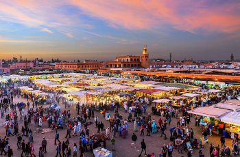 Famous Djemaa El Fna Square in early evening light, Marrakech, Morocco with the Koutoubia Mosque, Northern Africa.Nikon D3x